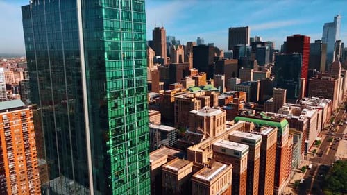 Distancing from the modern glass skyscraper towering above the high-rise buildings standing