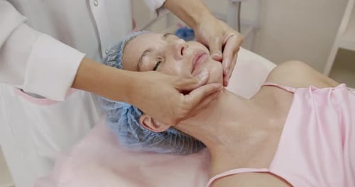 Professional Beautician Performing a Facial Treatment at Spa