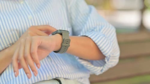 Close up of Female Hand Using Smartwatch Outdoor
