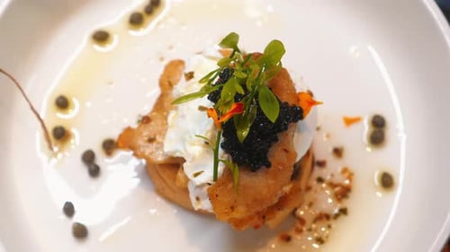 Elegant Food Dish with Caviar and Herbs