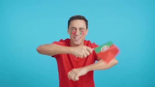 Energetic Man Waving a Flag in Excitement