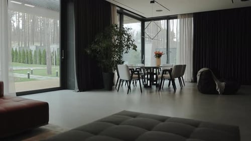 This Minimalist Interior Features a Cozy Dining Area Filled with Natural Light and Style