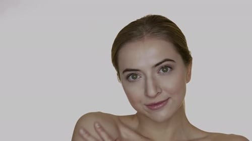 Woman Massaging Face in Close Up Beauty Shot