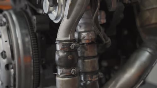 Car engine to be repaired by mechanic close up shot