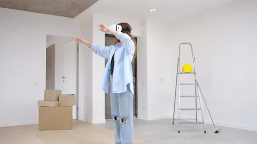 Young Woman Using Virtual Reality Headset in New Home