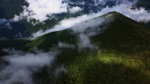 Mesmerizing Alpine View Green Mountains and Cloudfilled Valley
