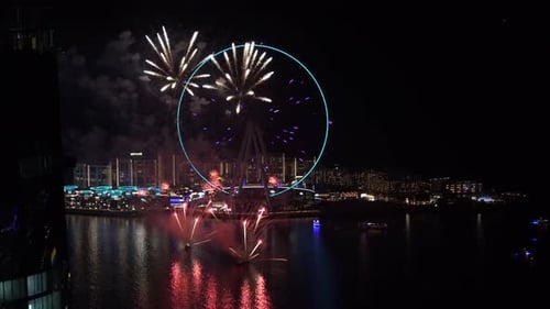 High-angle video of a fireworks show on the Ferris wheel in Dubai, UAE