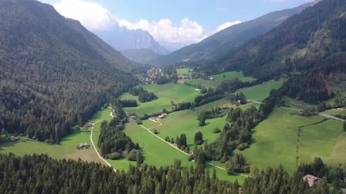 Aerial view of green valley and mountains, Italy.