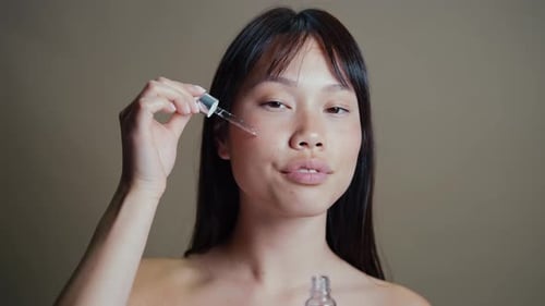 Asian woman beauty session in studio.