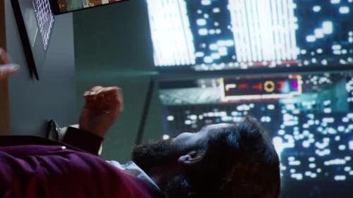 Bearded Man Video Conferencing in Dark Futuristic Setting