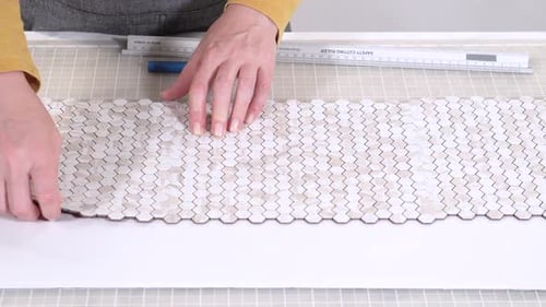 Arranging Mosaic Tiles on a Table Surface