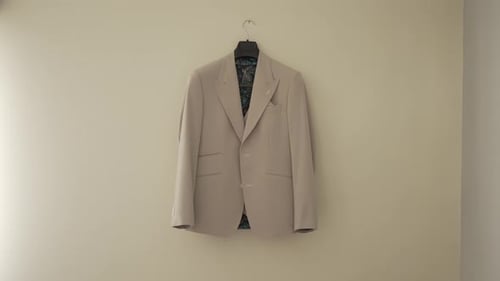 Elegant Suit Jacket Hanging on Wall