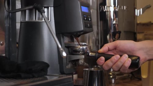 Professional Barista Making Espresso with Espresso Machine