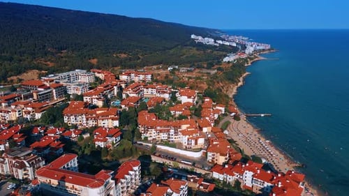 Multiple hotels with orange roofs at the rocky coast of the Black Sea.