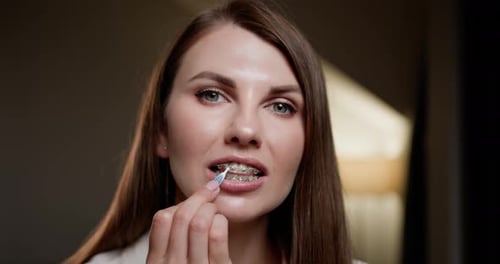 Concept of Oral Hygiene and Orthodontic Care Closeup View of Girl Cleaning