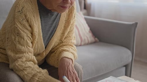 Senior Woman Reviewing Finances at Home
