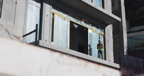 Walking, engineer and man with tablet, site and inspection of balcony, planning