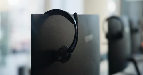 Call center, office or computer in empty room with headphones for contact us, faq or b2b