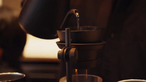 Pouring Coffee in Coffee Shop with Filter