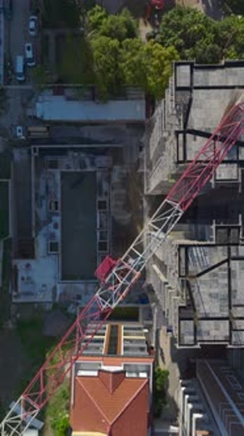 Vertical Video Multi Story Concrete Structure Under Development with Exposed Floors and City