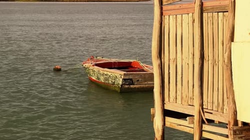 Captivating still footage of a waterfront scene as the camera captures the gradual submersion of a w