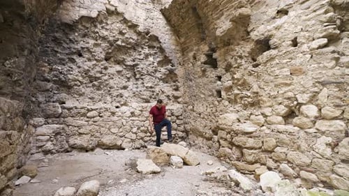 Bukelon Fortress Interior – Man Walking Among Ruins