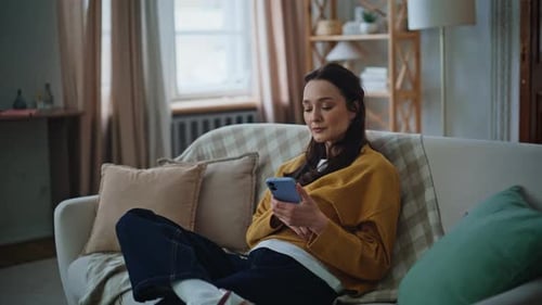 Bored Woman Checking Smartphone Waiting Message Sitting Comfortable Couch