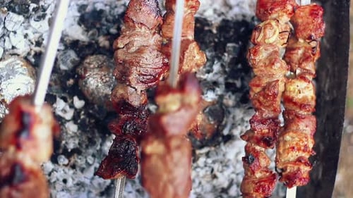 Grilled Meat. Man Takes Off Skewers With Cooked Meat From Grill. Bbq Meat Ready. Barbeque Meat. T...