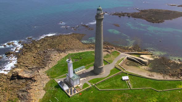 Aerial View Of Phare De L le Vierge Lighthouse And Rocky Coastline In aerial-view-of-phare-de-l-le-vierge-lighthouse-and-rocky-coastline-in