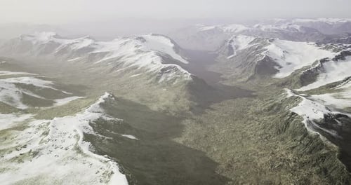 Majestic Mountain Landscape with Snow Capped Peaks and Rocky Valleys