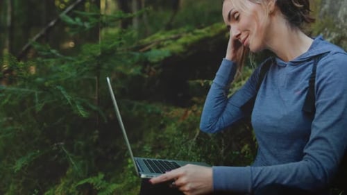 Beautiful Girl Work on Laptop in Green Forest