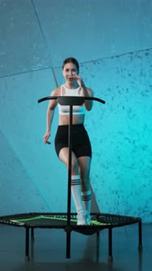 Woman Bouncing on Mini Trampoline for Exercise