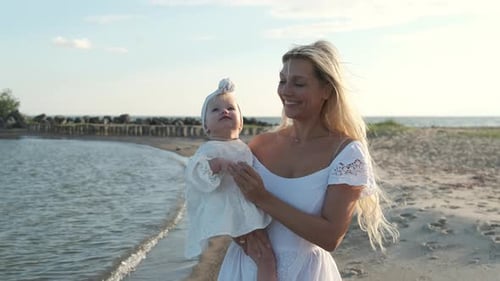 Mother and Baby on a Sunny Beach