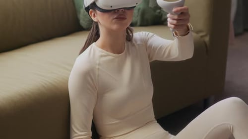 Woman Using Virtual Reality Headset at Home
