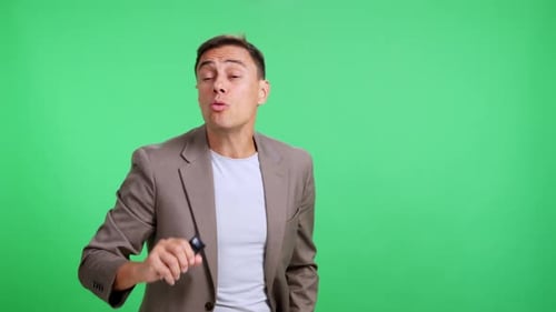 Charismatic Male Speaker Presenting Against a Green Screen Background