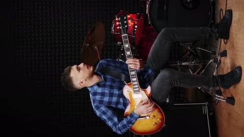 Guitarist playing on electric guitar