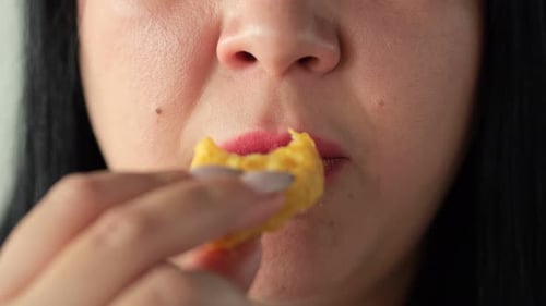 Woman Eats Juicy Nuggets From Fast Food Restaurant at Home