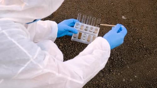 Scientist Takes Soil Samples for Testing