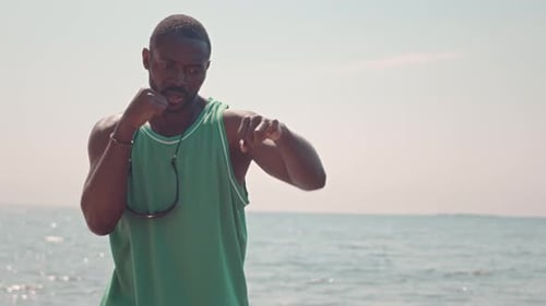 Black Man Boxing at Beach