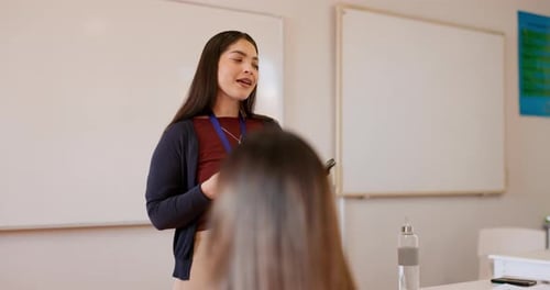 Teacher Giving a Lecture in Classroom to Students