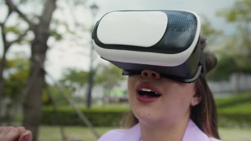 Zoomer in AR Goggles Exploring Metaverse in City Park