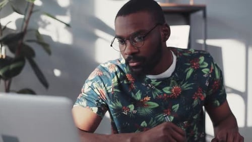 Close Up Face African American Man Working on Laptop Graphic Tablet Sit Design House Face Technology
