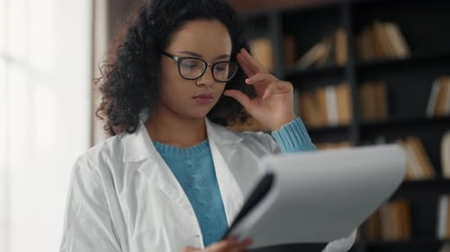 Young Woman Doctor in Hospital Office Serious Medical Student Girl Wearing White Medical Coat Look