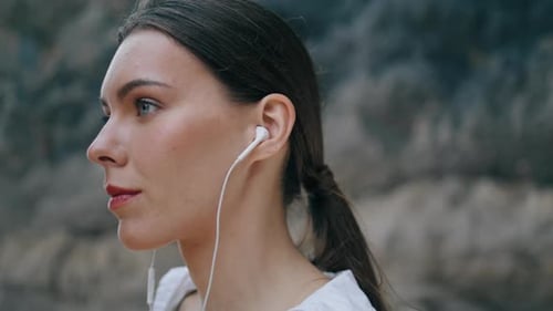 Portrait Woman Listening Music By Earphones in Front Sandy Hill