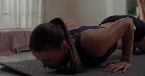 Fit Woman Doing Push-ups at Home