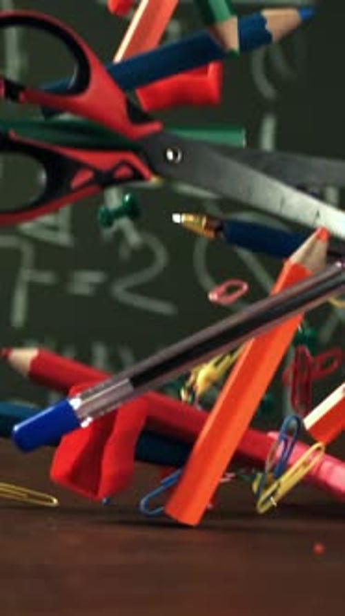 Various School Tools Fall on the Desk Filmed on a Highspeed Camera at 1000 Fps