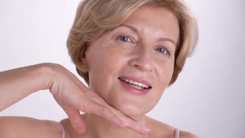 Elegant Woman Touching Face in Close Up