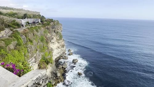 Very picturesque shot of the coastline at Uluwatu, Bali, Indonesia. The rugged cliffs meet the blue