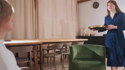 Wellness Guide Offers Clay Activity to Patient in Cozy Therapy Room