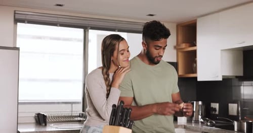 Loving Couple Preparing Food Together in Modern Kitchen